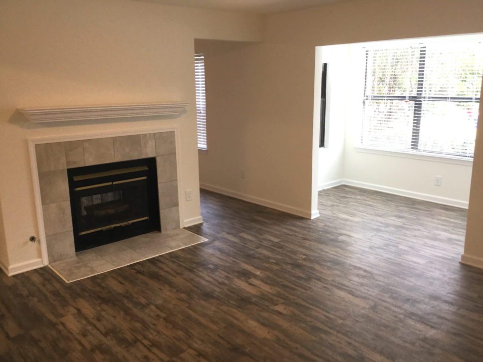 Grove Parkview Apartments in Stone Mountain A luxury two bedroom apartment with hardwood floors and a fireplace.