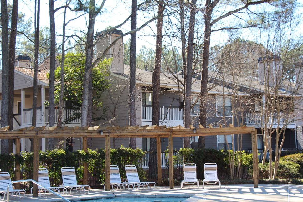Grove Parkview Apartments in Stone Mountain Decorating Your Apartment with a Pool and Lounge Chairs