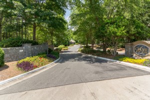 Apartments for rent in Stone Mountain, GA - Entrance Drive to Community and Sign            